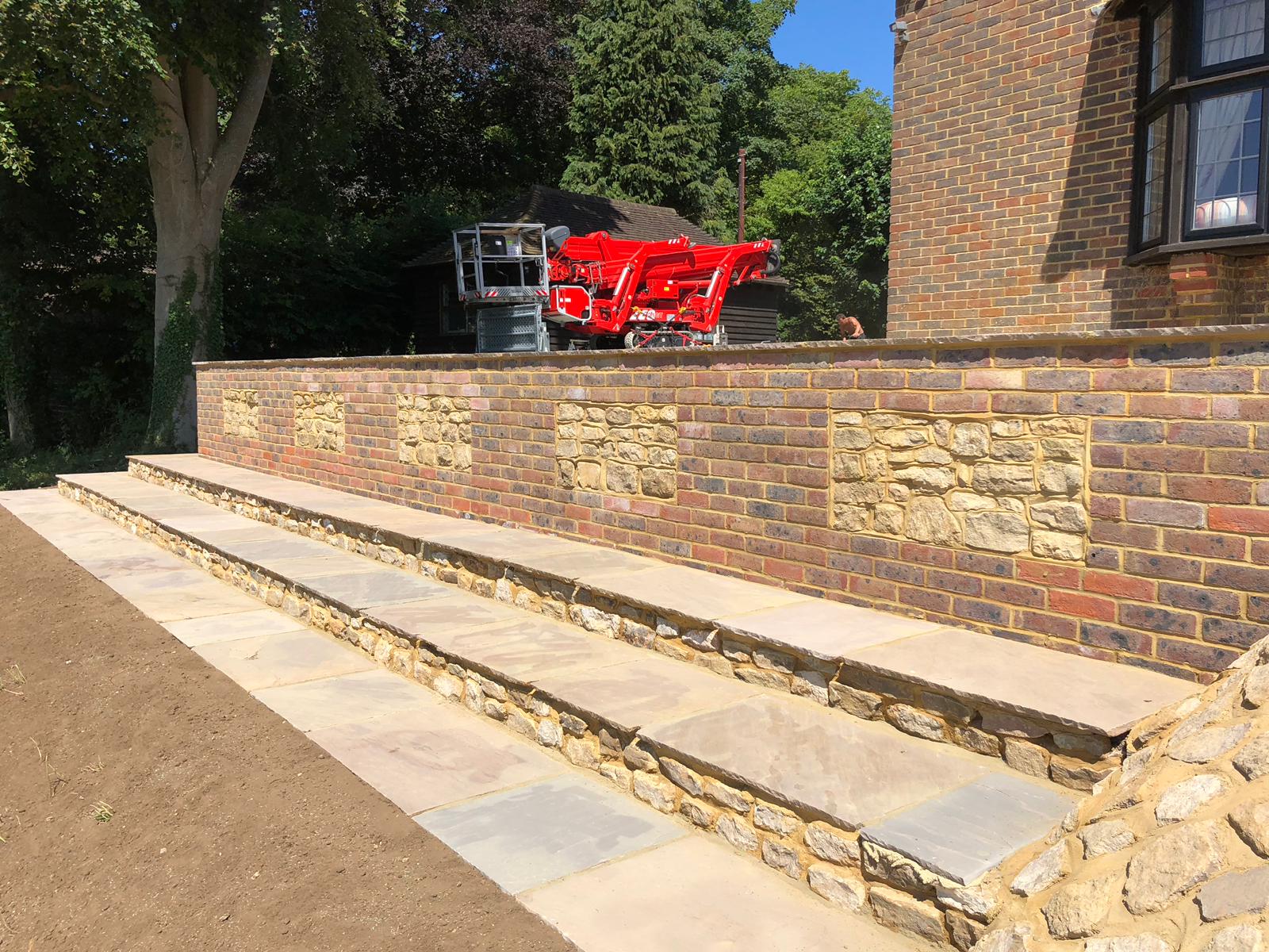 Brick and Bargate stone wall with sandstone steps